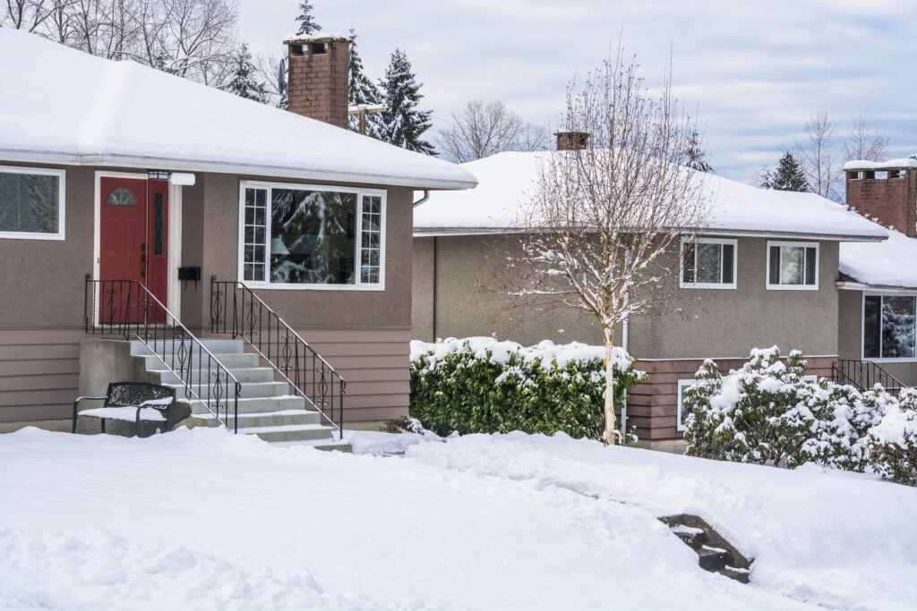 Grooved concrete steps showing surface wear from freeze-thaw cycles in winter.