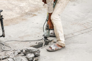 Resurfacing damaged concrete with overlay compound after freeze-thaw scaling
